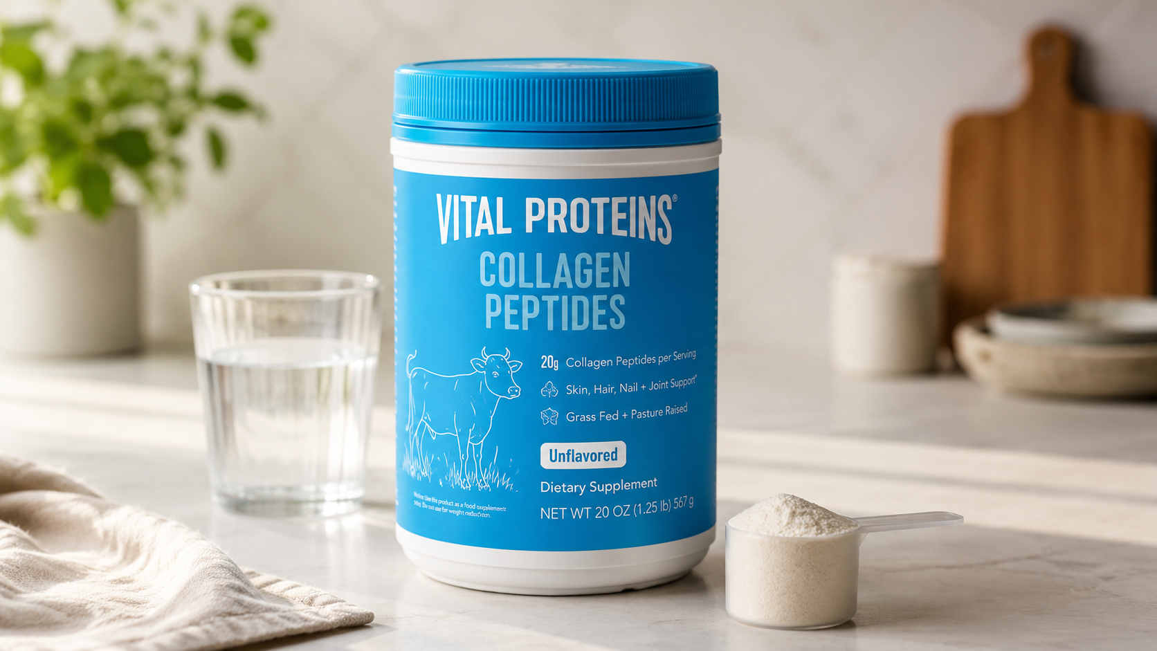 Vital Proteins Collagen Peptides unflavored collagen powder container on a marble kitchen countertop with a scoop of collagen powder and glass of water, ideal for daily skin, hair, nail, and joint support.