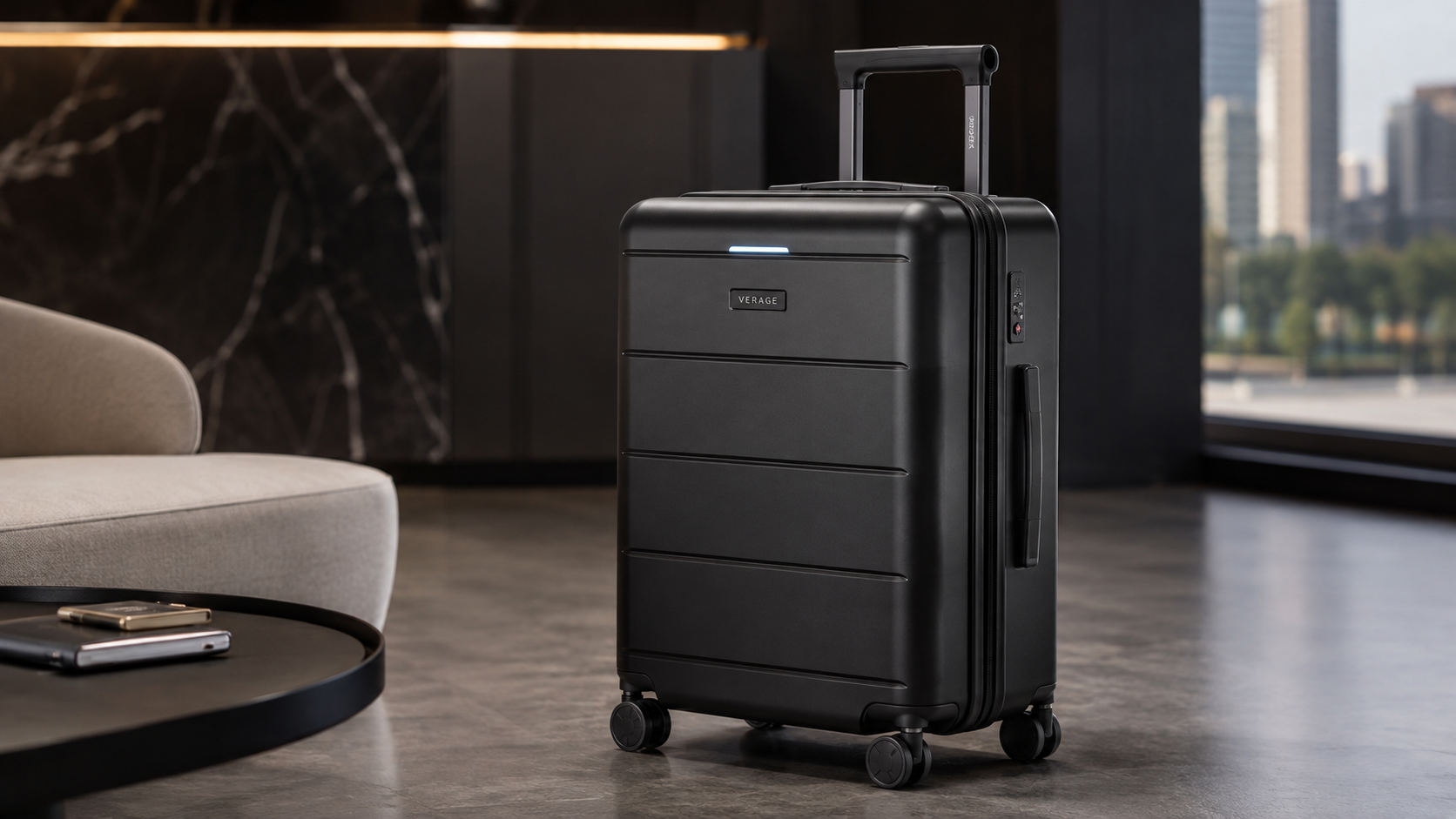 VERAGE Greenwich Smart Luggage black hard-shell carry-on suitcase with spinner wheels and TSA lock displayed in a modern airport lounge, ideal for business and leisure travel.
